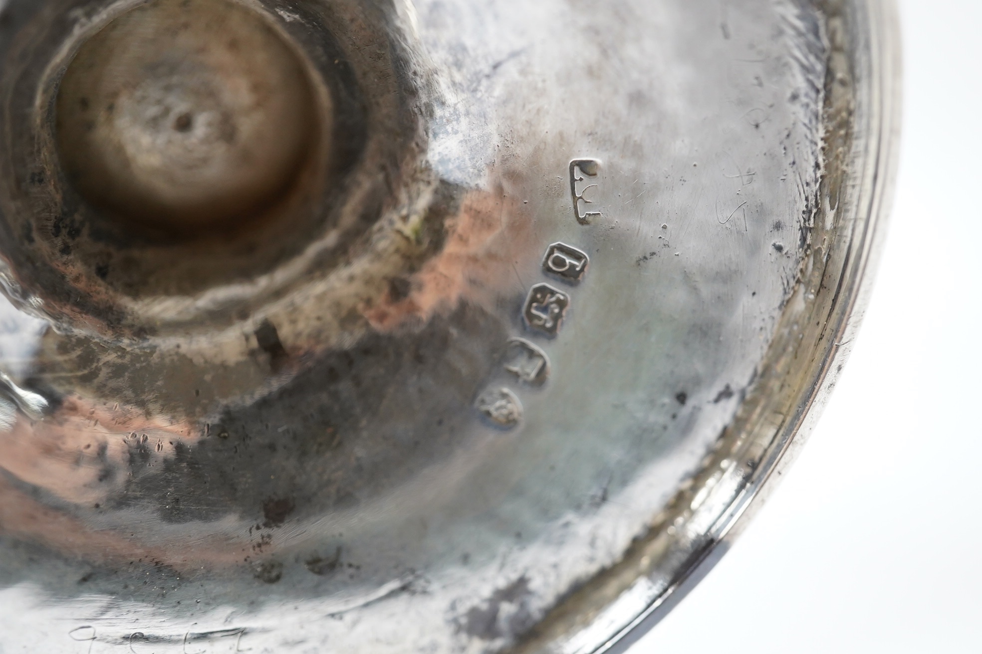 A George II small silver sauceboat, Gwillim & Castle, London, 1744, length 13.6cm, together with a George III silver hot water jug, London, 1791, gross 9.6oz. Condition - poor